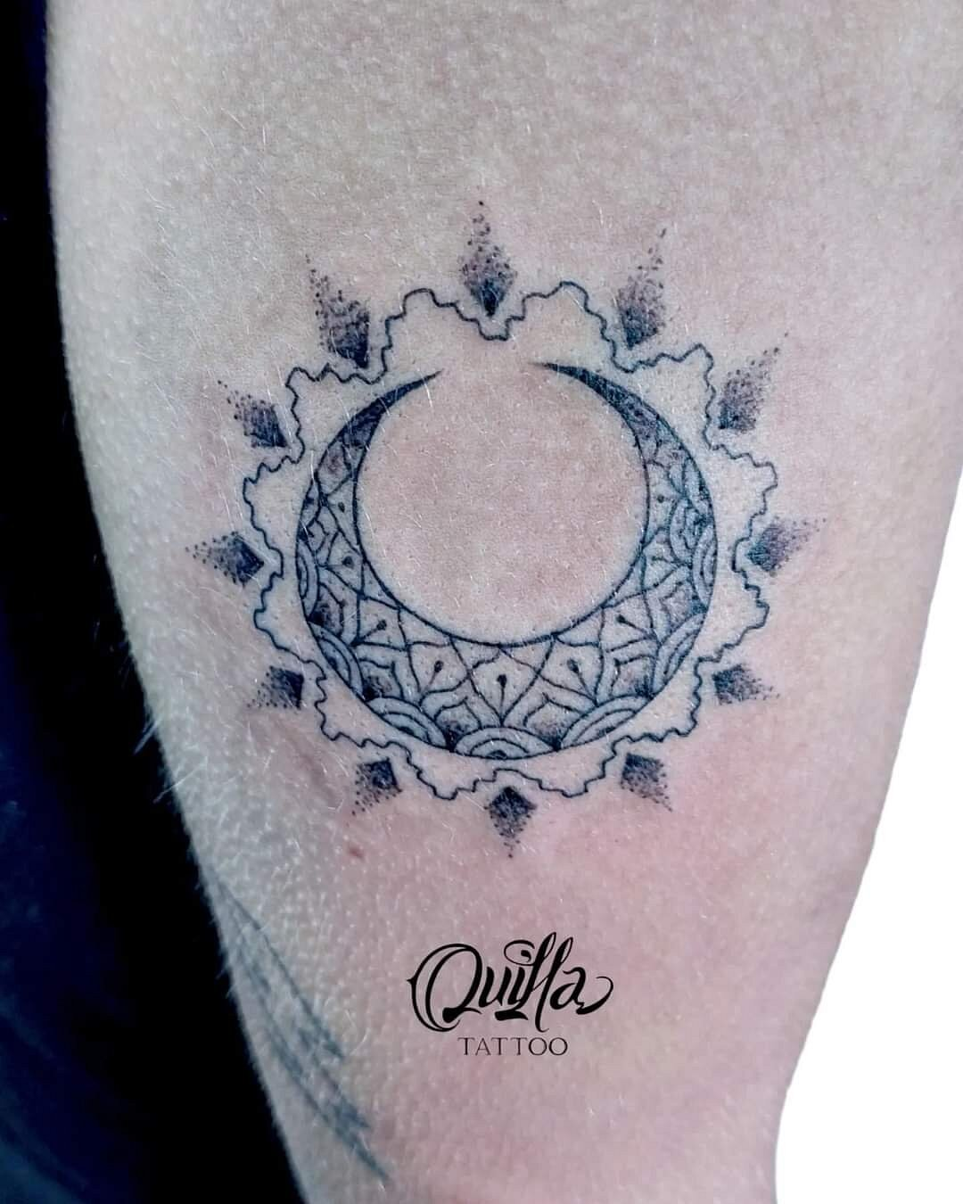 Ornamental moon dotwork tattoo on arm - geometric crescent with mandala details by Quilla Tattoo